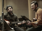 Folk singer Llewyn Davis (Oscar Isaac, left) is barely surviving the 1961 winter in New York, living off the proceeds of his occasional gigs — and the kindness of friends like Jim (Justin Timberlake). Folk singer Llewyn Davis (Oscar Isaac, left) is barely surviving the 1961 winter in New York, living off the proceeds of his occasional gigs — and the kindness of friends like Jim (Justin Timberlake).