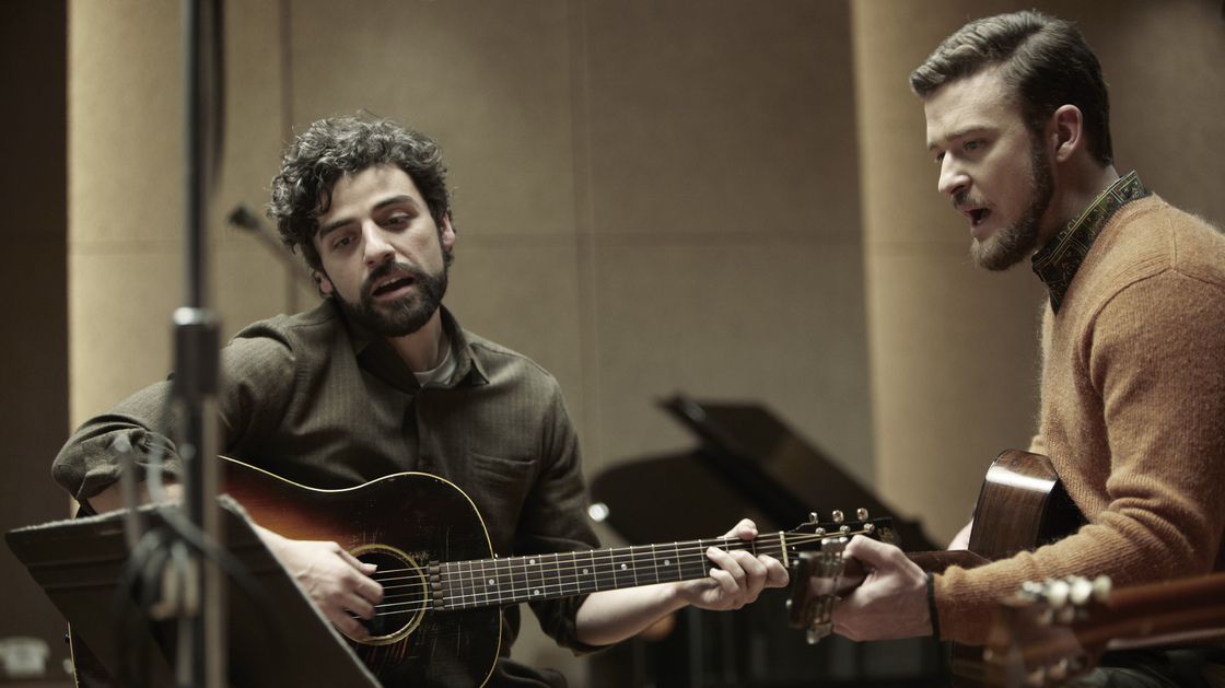 Folk singer Llewyn Davis (Oscar Isaac, left) is barely surviving the 1961 winter in New York, living off the proceeds of his occasional gigs — and the kindness of friends like Jim (Justin Timberlake).