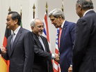 Iranian Foreign Minister Mohammad Javad Zarif shakes hands with U.S. Secretary of State John Kerry on Nov. 24 in Geneva, after the announcement of a deal halting parts of Iran's nuclear program. Iranian Foreign Minister Mohammad Javad Zarif shakes hands with U.S. Secretary of State John Kerry on Nov. 24 in Geneva, after the announcement of a deal halting parts of Iran's nuclear program.