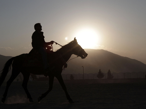 An Afghan man rides a horse at sunset on Nadir Khan hill in Kabul, Afghanistan. Auliya Atrafi paid thousands of dollars and risked his life to escape the Taliban-controlled country, only to return after 12 years living in England. An Afghan man rides a horse at sunset on Nadir Khan hill in Kabul, Afghanistan. Auliya Atrafi paid thousands of dollars and risked his life to escape the Taliban-controlled country, only to return after 12 years living in England.