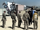 U.S. soldiers look at a crane that tipped over while trying to move a CHU, or Containerized Housing Unit, at a small COP, or Combat Outpost, in southern Afghanistan. A dozen years of war in Iraq and Afghanistan have created a whole new military vocabulary. U.S. soldiers look at a crane that tipped over while trying to move a CHU, or Containerized Housing Unit, at a small COP, or Combat Outpost, in southern Afghanistan. A dozen years of war in Iraq and Afghanistan have created a whole new military vocabulary.