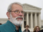 John Dennis Apel speaks outside the Supreme Court on Wednesday, after oral arguments in his case. The justices are considering whether Apel has the right to protest at a military base. John Dennis Apel speaks outside the Supreme Court on Wednesday, after oral arguments in his case. The justices are considering whether Apel has the right to protest at a military base.