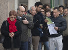 People line up outside a government unemployment office in Madrid on Oct. 5. Spain has an unemployment rate of 26 percent. People line up outside a government unemployment office in Madrid on Oct. 5. Spain has an unemployment rate of 26 percent.