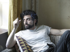 Oscar Isaac as the titular character in Joel and Ethan Coen's Inside Llewyn Davis. Oscar Isaac as the titular character in Joel and Ethan Coen's Inside Llewyn Davis.