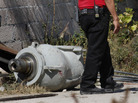 A firefighter stands next to the radiation head which contained the stolen cobalt-60. A firefighter stands next to the radiation head which contained the stolen cobalt-60.