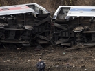 A police officer stands guard at the scene of a Metro-North passenger train derailment in the Bronx borough of New York on Dec. 1. A police officer stands guard at the scene of a Metro-North passenger train derailment in the Bronx borough of New York on Dec. 1.