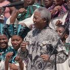 South African President Nelson Mandela joins the choral group at the signing of the country's new constitution at Sharpeville stadium in 1996. Mandela lived a life filled with rich musical associations. South African President Nelson Mandela joins the choral group at the signing of the country's new constitution at Sharpeville stadium in 1996. Mandela lived a life filled with rich musical associations.