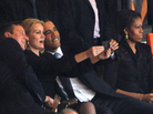 President Obama and British Prime Minister David Cameron pose for a picture with Denmark's Prime Minister, Helle Thorning Schmidt, during the memorial service for Nelson Mandela Tuesday in Johannesburg, South Africa. First lady Michelle Obama is on the right. President Obama and British Prime Minister David Cameron pose for a picture with Denmark's Prime Minister, Helle Thorning Schmidt, during the memorial service for Nelson Mandela Tuesday in Johannesburg, South Africa. First lady Michelle Obama is on the right.