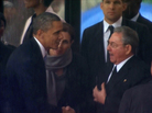 In this image from TV, President Obama shakes hands with Cuban President Raul Castro at the memorial service for former South African President Nelson Mandela in Johannesburg on Tuesday. In this image from TV, President Obama shakes hands with Cuban President Raul Castro at the memorial service for former South African President Nelson Mandela in Johannesburg on Tuesday.