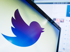 The Twitter logo is displayed on a computer screen. The Twitter logo is displayed on a computer screen.