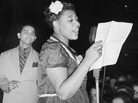 Ella Fitzgerald sings with bandleader Chick Webb in Asbury Park, N.J., in 1938. Ella Fitzgerald sings with bandleader Chick Webb in Asbury Park, N.J., in 1938.
