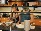 Binh Hua (left) and My Nguyen, both 18, work in the Garden City Community College chemistry lab. Both of their parents are employed by the Tyson Foods plant in Garden City, Kan. Binh Hua (left) and My Nguyen, both 18, work in the Garden City Community College chemistry lab. Both of their parents are employed by the Tyson Foods plant in Garden City, Kan.