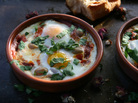 Eggs are baked in a savory sauce in this Berber Omelet recipe Eggs are baked in a savory sauce in this Berber Omelet recipe