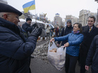 U.S. Assistant Secretary for European and Eurasian Affairs Victoria Nuland offered food to pro-European Union activists as she and U.S. Ambassador to Ukraine Geoffrey Pyatt, right, walked through Independence Square in Kiev, Ukraine, on Wednesday. She also offered food to some of the police nearby. U.S. Assistant Secretary for European and Eurasian Affairs Victoria Nuland offered food to pro-European Union activists as she and U.S. Ambassador to Ukraine Geoffrey Pyatt, right, walked through Independence Square in Kiev, Ukraine, on Wednesday. She also offered food to some of the police nearby.