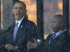 As President Obama and other world leaders spoke Tuesday in Johannesburg at a memorial for Nelson Mandela, a man stood nearby and appeared to be doing sign language interpretation. Many in the deaf community are outraged because the man appeared to be faking. As President Obama and other world leaders spoke Tuesday in Johannesburg at a memorial for Nelson Mandela, a man stood nearby and appeared to be doing sign language interpretation. Many in the deaf community are outraged because the man appeared to be faking.