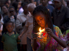 On Dec. 8, three days after Nelson Mandela's death, a girl in Johannesburg lights a candle in his memory. Poet Mbali Vilakazi has written an elegy for Mandela that asks the next generation of South Africans to continue his legacy. On Dec. 8, three days after Nelson Mandela's death, a girl in Johannesburg lights a candle in his memory. Poet Mbali Vilakazi has written an elegy for Mandela that asks the next generation of South Africans to continue his legacy.