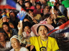 Anti-government protesters react to a speech by former Democrat Party MP and anti-government protest leader Suthep Thaugsuban during a large rally near Government House on Tuesday in Bangkok. Anti-government protesters react to a speech by former Democrat Party MP and anti-government protest leader Suthep Thaugsuban during a large rally near Government House on Tuesday in Bangkok.