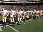 Navy players await the start of their annual game against Army, on Dec. 1, 2001. Navy players await the start of their annual game against Army, on Dec. 1, 2001.