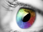 Black and white photo of an eye; the iris is colored in multiple hues. Black and white photo of an eye; the iris is colored in multiple hues.