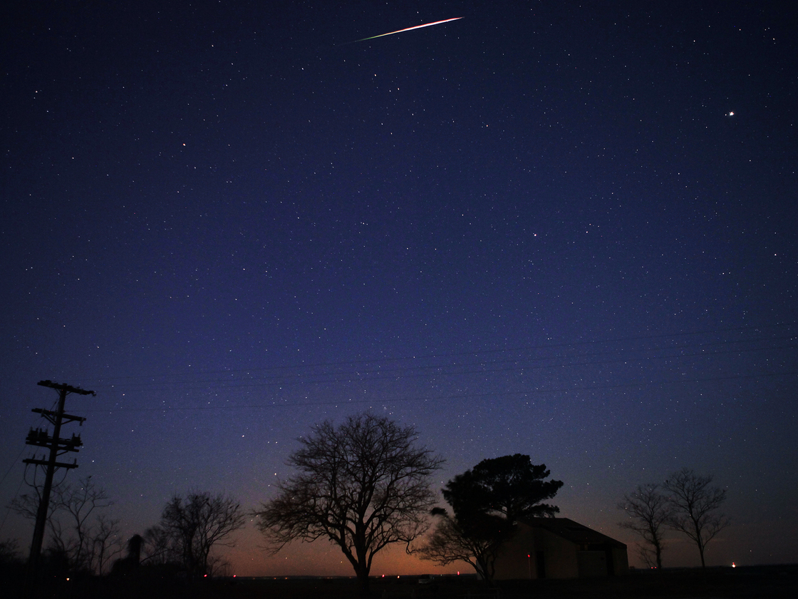 A Geminid meteor streaks across the sky in the early morning of December 13, 2013 near Scotland, Maryland. A Geminid meteor streaks across the sky in the early morning of December 13, 2013 near Scotland, Maryland.