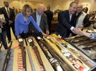 Former Rep. Gabby Giffords and her husband, Mark Kelly, at a gun show in Saratoga Springs, N.Y., in October. Giffords was shot in the head in a 2011 mass shooting in Tucson. She and Kelly have since founded a political action committee to push for tougher gun laws. Former Rep. Gabby Giffords and her husband, Mark Kelly, at a gun show in Saratoga Springs, N.Y., in October. Giffords was shot in the head in a 2011 mass shooting in Tucson. She and Kelly have since founded a political action committee to push for tougher gun laws.