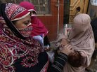 A polio worker vaccinates a child in Khyber-Pakhtunkhwa province, Pakistan, in October. A polio worker vaccinates a child in Khyber-Pakhtunkhwa province, Pakistan, in October.