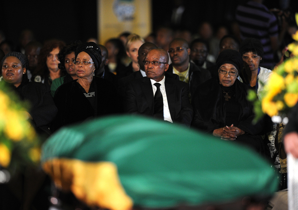 South African President Jacob Zuma, widow of late South African President Nelson Mandela, Graca Machel and Mandela's ex-wife Winnie Mandela Madikizela, right, attend a Farewell Service on Saturday at the Waterkloof air force base in Pretoria.