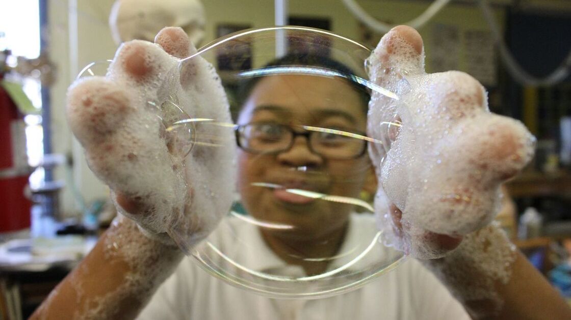Hands-on science activities like making bubble mitts at the Mission Science Workshop teach students about things like surface tension. Hands-on science activities like making bubble mitts at the Mission Science Workshop teach students about things like surface tension.