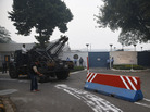 Indian workers remove Tuesday a barricade that had been erected as a safety measure outside the main entrance of U.S. Embassy in New Delhi. The move follows the arrest of an Indian diplomat in New York. Indian workers remove Tuesday a barricade that had been erected as a safety measure outside the main entrance of U.S. Embassy in New Delhi. The move follows the arrest of an Indian diplomat in New York.