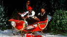 Run-DMC, in a sleigh with a Cadillac emblem. Run-DMC, in a sleigh with a Cadillac emblem.