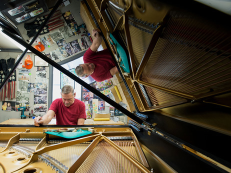 Some Steinway company representatives and employees — like Wally Boot, pictured here — have been working for the company for decades. Boot is the last person to touch every piano that leaves the factory in Queens, N.Y. Some Steinway company representatives and employees — like Wally Boot, pictured here — have been working for the company for decades. Boot is the last person to touch every piano that leaves the factory in Queens, N.Y.
