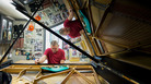 Some Steinway company representatives and employees — like Wally Boot, pictured here — have been working for the company for decades. Boot is the last person to touch every piano that leaves the factory in Queens, N.Y. Some Steinway company representatives and employees — like Wally Boot, pictured here — have been working for the company for decades. Boot is the last person to touch every piano that leaves the factory in Queens, N.Y.