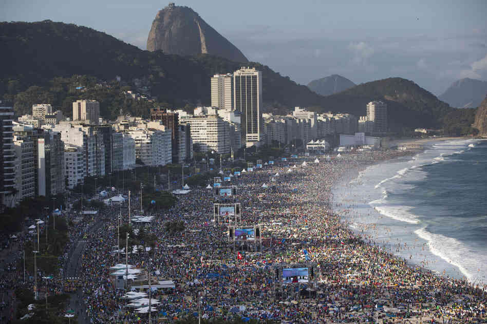 Pilgrims and residents gather on Copacabana beach before the arrival of Pope Francis for World Youth Day in Rio de Janeiro in July. Pilgrims and residents gather on Copacabana beach before the arrival of Pope Francis for World Youth Day in Rio de Janeiro in July.