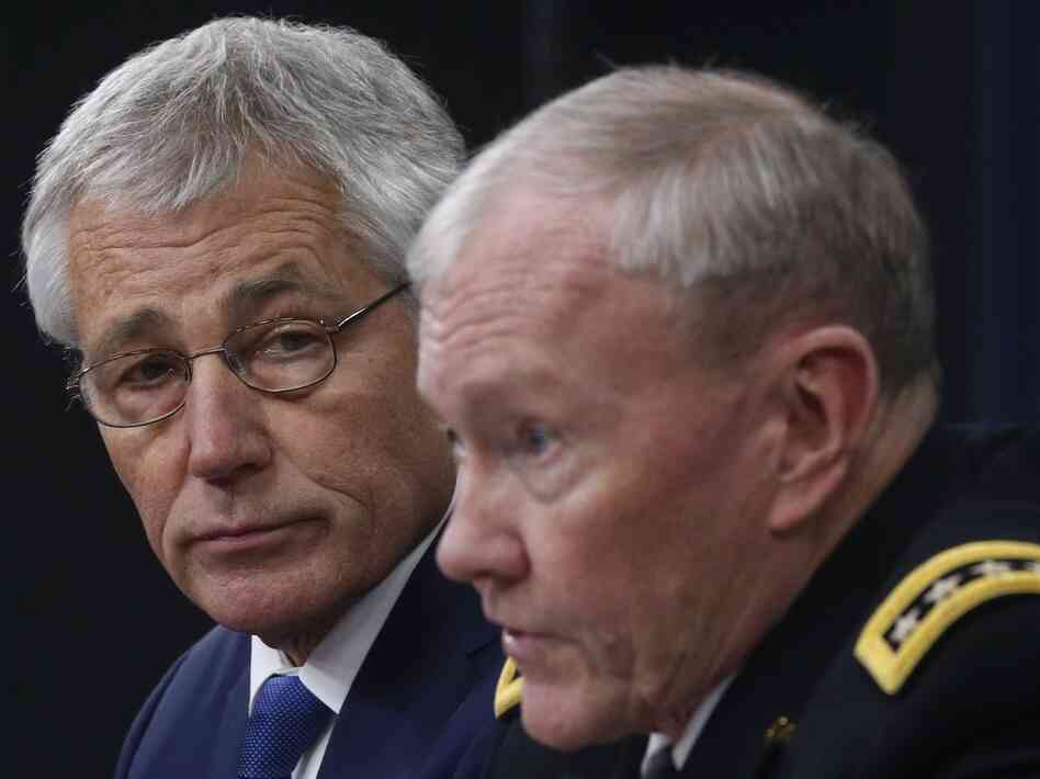 Defense Secretary Chuck Hagel and Chairman of the Joint Chiefs of Staff Gen. Martin Dempsey brief reporters at the Pentagon in Washington, on Thursday. Defense Secretary Chuck Hagel and Chairman of the Joint Chiefs of Staff Gen. Martin Dempsey brief reporters at the Pentagon in Washington, on Thursday.