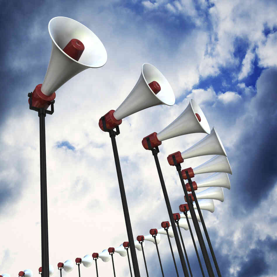 An array of loudspeakers against a dramatic sky. 3D render with HDRI lighting and raytraced textures. An array of loudspeakers against a dramatic sky. 3D render with HDRI lighting and raytraced textures.
