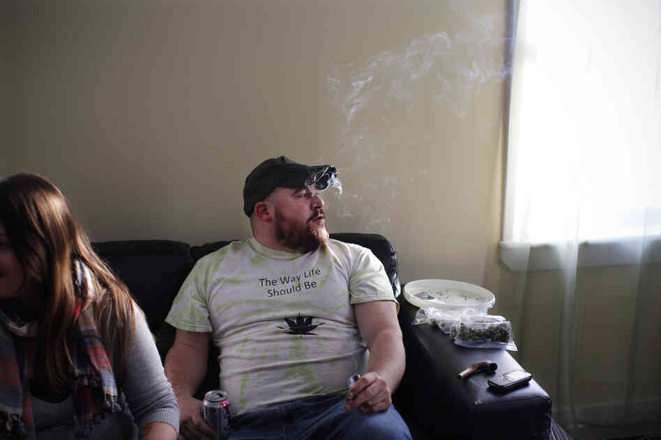 Ryan Begin treats his PTSD by smoking a joint in his home in Belfast, Maine. Ryan Begin treats his PTSD by smoking a joint in his home in Belfast, Maine.