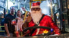 A driver disguised as Santa Claus drives a public bus at Paulista Avenue in Sao Paulo, Brazil. A driver disguised as Santa Claus drives a public bus at Paulista Avenue in Sao Paulo, Brazil.