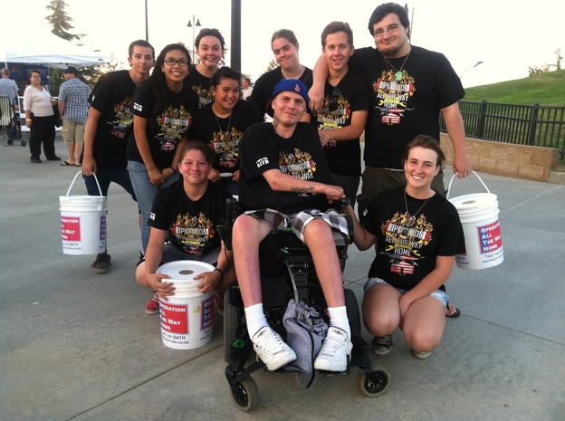 High school students from Lancaster, Calif., held yard sales and bake sales to raise money to build a new house for Iraq War veteran Jerrell Hancock, center. Unlike Hancock's current mobile home, the new house will be wheelchair-accessible. (Image credit: Gloria Hillard)