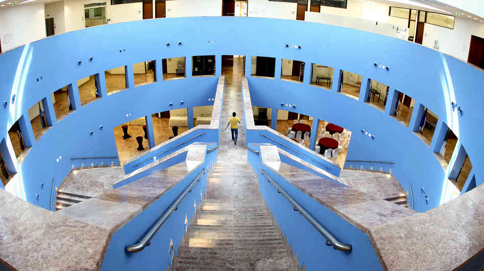 A man walks along a pathway at the Texas A&M University campus in Doha, Qatar. A man walks along a pathway at the Texas A&M University campus in Doha, Qatar.