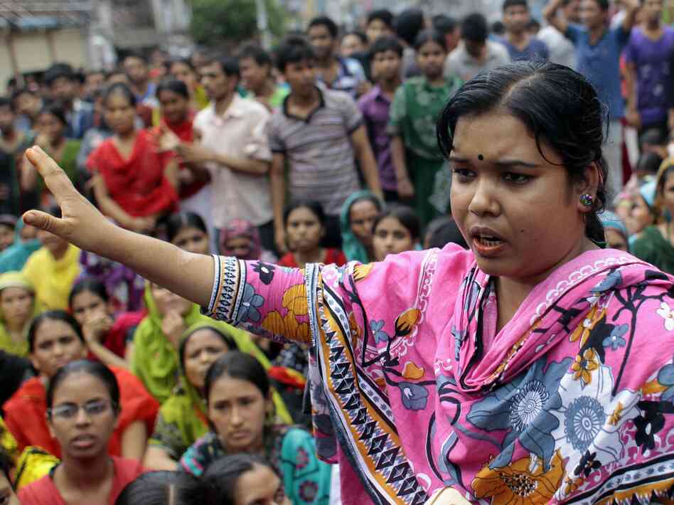 A Bangladeshi worker participates in a protest outside a garment factory in Dhaka. A Bangladeshi worker participates in a protest outside a garment factory in Dhaka.