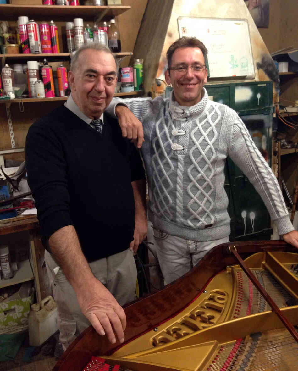 Michel Labord (left) technical director of the Colmann piano company, restores a Pleyel piano in his workshop with company founder Olivier Colin. Michel Labord (left) technical director of the Colmann piano company, restores a Pleyel piano in his workshop with company founder Olivier Colin.