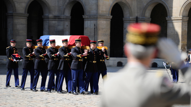 Pallbearers carry the flag-draped coffin of Francois Jacob, Nobel Prize-winner and World War II veteran, in Paris on April 24. (Image credit: Reuters/Landov)
