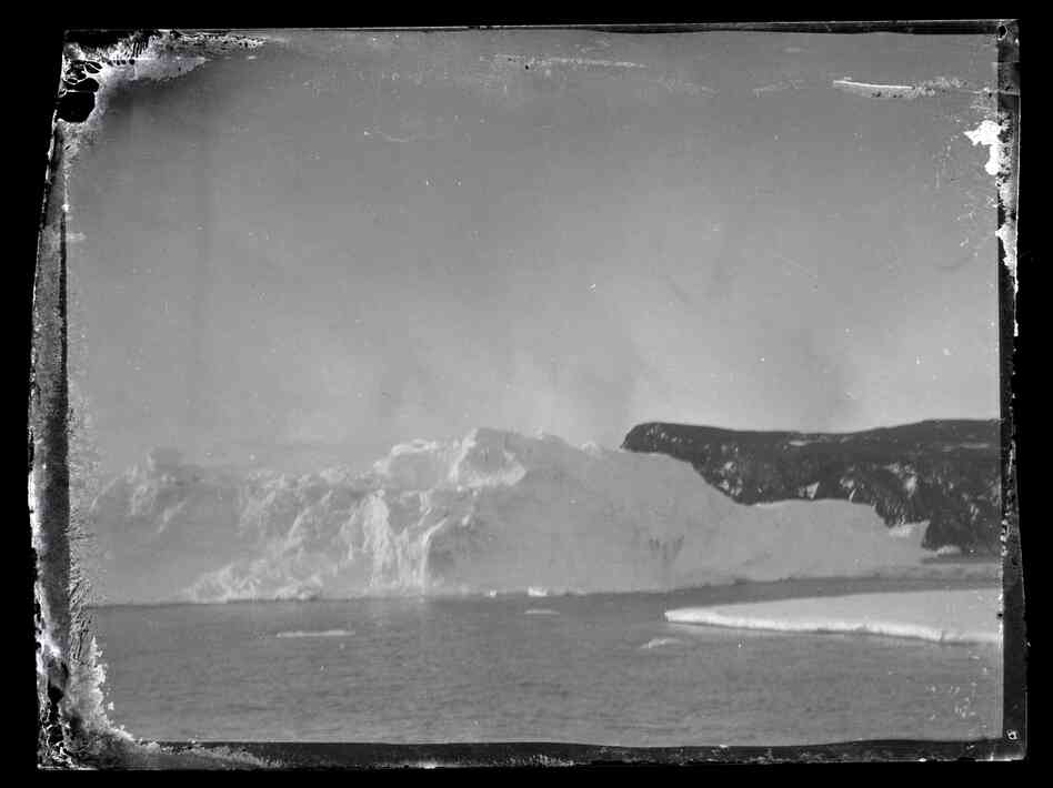 Iceberg and land, Ross Island. Iceberg and land, Ross Island.