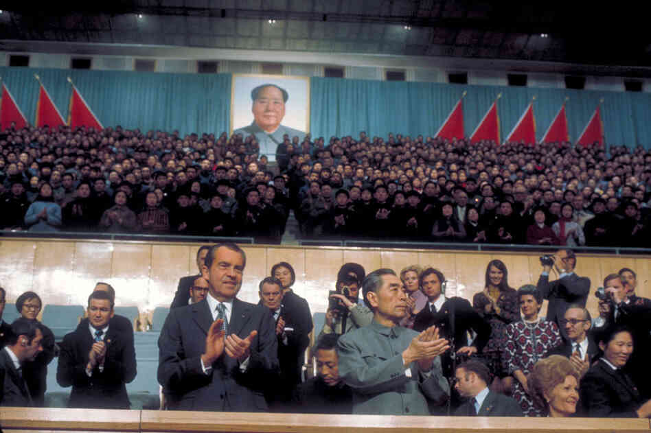 President Richard Nixon and Chinese Premier Chou En Lai watching a pingpong match during Nixon's visit to China, 1972