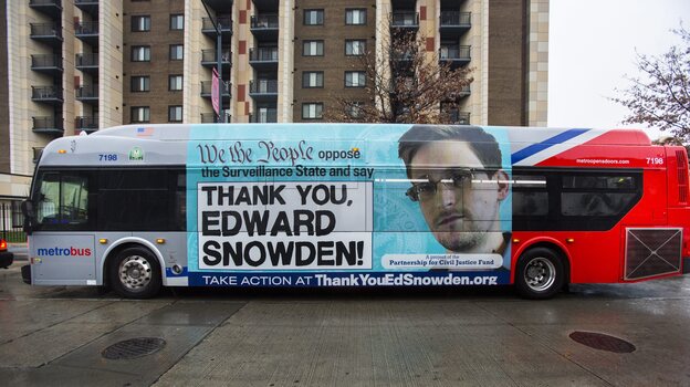 An advertisement thanking NSA leaker Edward Snowden appears on the side of a Metrobus in downtown Washington, D.C., in November. (EPA /Landov)