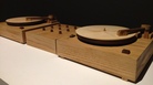 Two turntables carved from wood scratch out the sound of Beat Nation artist Jordan Bennett learning his native Mi'kmaq language. Two turntables carved from wood scratch out the sound of Beat Nation artist Jordan Bennett learning his native Mi'kmaq language.
