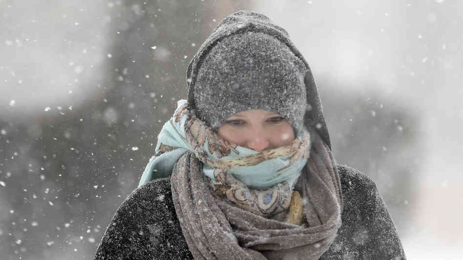 Jenny Hackett walks across a street in St. Louis, Mo., on Sunday. Subzero temperatures are predicted there Monday, with bitter cold sweeping east. Jenny Hackett walks across a street in St. Louis, Mo., on Sunday. Subzero temperatures are predicted there Monday, with bitter cold sweeping east.