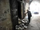 A man inspects burnt books in north Lebanon's majority Sunni city of Tripoli on Saturday, a day after a decades-old library owned by a Greek Orthodox priest was burned. A man inspects burnt books in north Lebanon's majority Sunni city of Tripoli on Saturday, a day after a decades-old library owned by a Greek Orthodox priest was burned.