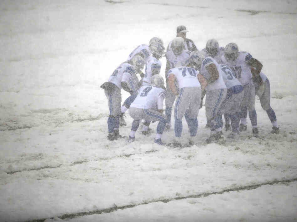 The Detroit Lions huddle during a snowstorm in the first half of a game against the Philadelphia Eagles in December. The Detroit Lions huddle during a snowstorm in the first half of a game against the Philadelphia Eagles in December.