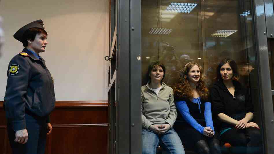 Pussy Riot members Yekaterina Samutsevich (left), Maria Alyokhina and Nadezhda Tolokonnikova sit in a glass-walled cage in a Moscow court on Oct. 10, 2012. Pussy Riot members Yekaterina Samutsevich (left), Maria Alyokhina and Nadezhda Tolokonnikova sit in a glass-walled cage in a Moscow court on Oct. 10, 2012.